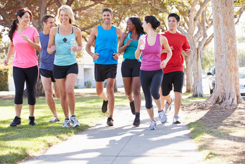 Group Of Runners On Suburban Street