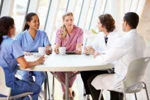 Medical Staff Chatting In Modern Hospital Canteen